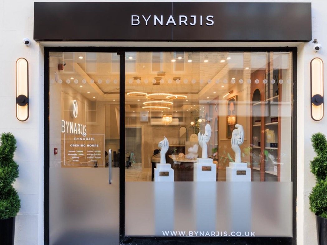 The By Narjis shopfront at 17 Thayer Street, with bay trees either side of the door